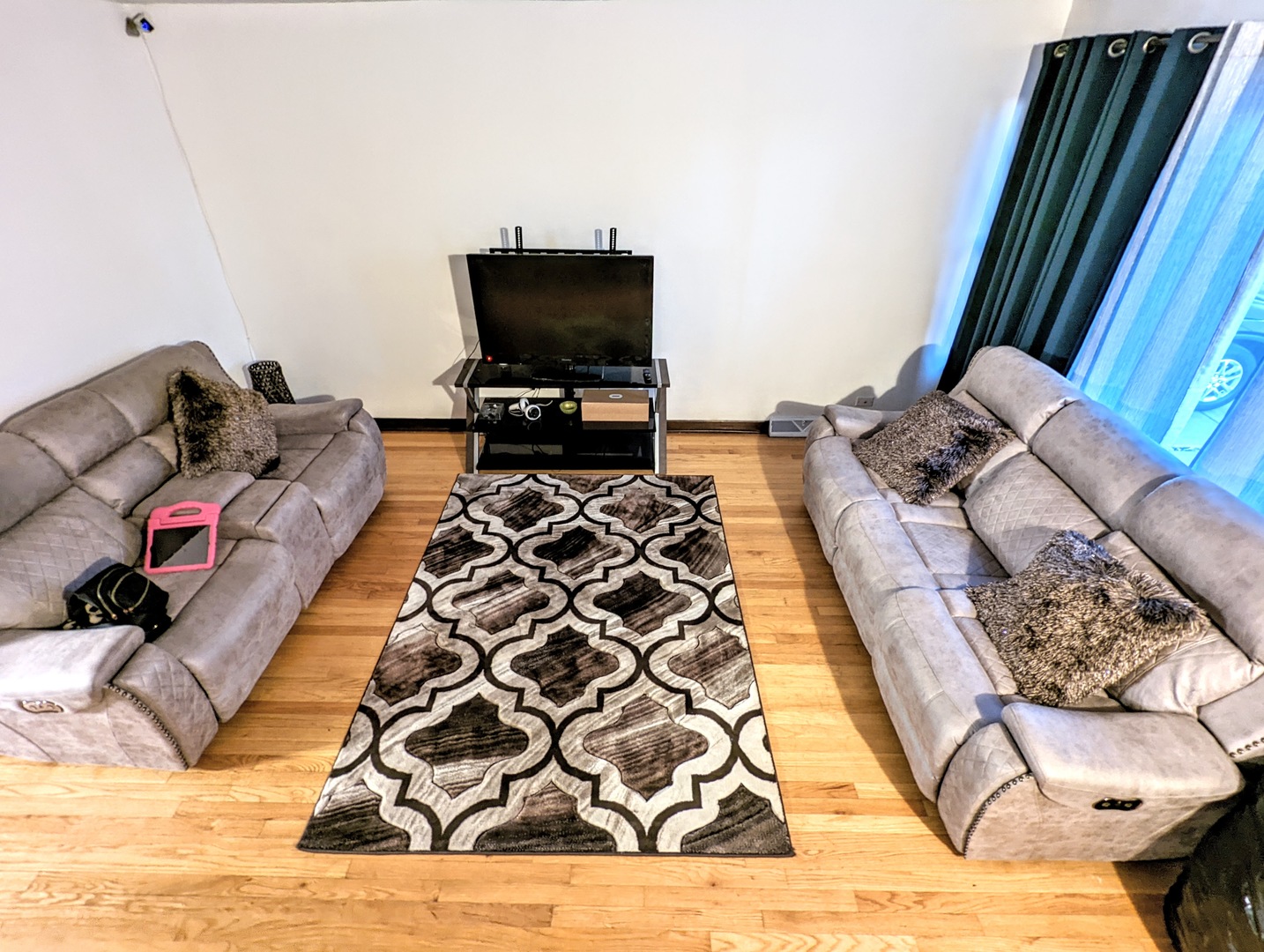 762 Pulaski Road Calumet City, IL 60409 - Photo 2 of 4 a living room with furniture and a flat screen tv