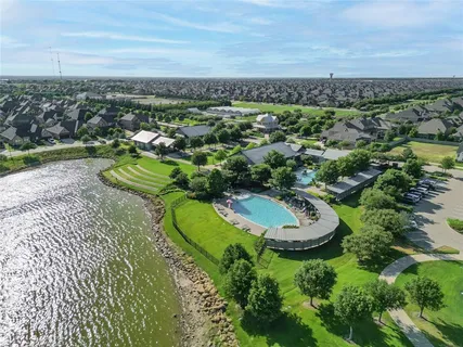 an aerial view of a house with a swimming pool