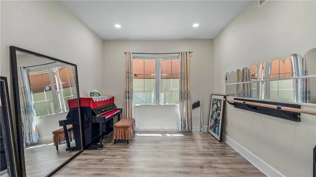 a bathroom with a granite countertop toilet sink and mirror