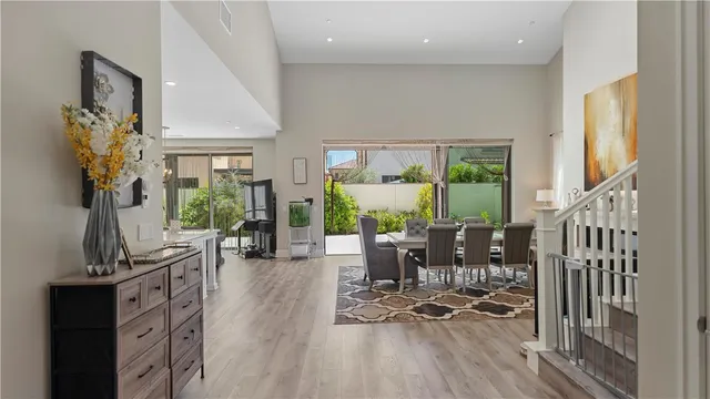 a view of an entryway with dining room and wooden floor