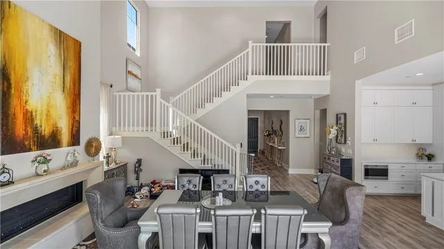 a large white kitchen with stainless steel appliances