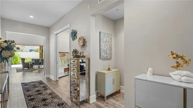 a view of hallway with wooden floor