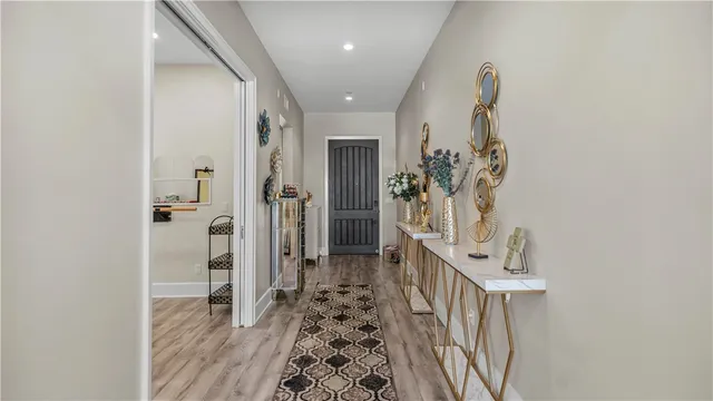 a view of entryway with wooden floor and stairs