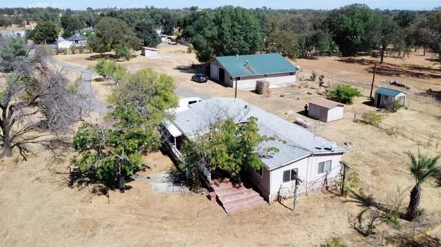 a view of a porch with wooden floor and outdoor space