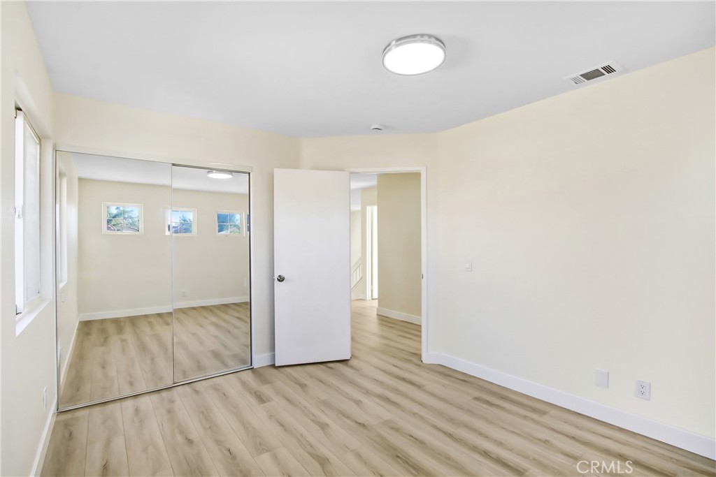 44738 Corte Gutierrez Temecula, CA 92592 - Photo 14 of 24 an empty room with wooden floor and windows