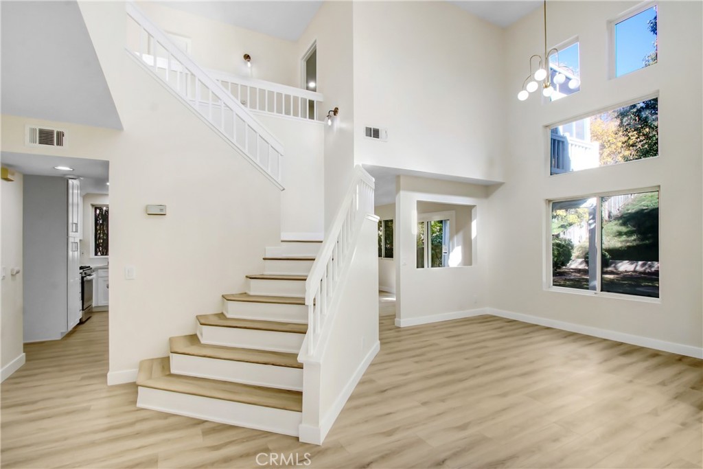 44738 Corte Gutierrez Temecula, CA 92592 - Photo 21 of 24 a view of entryway and hall with wooden floor