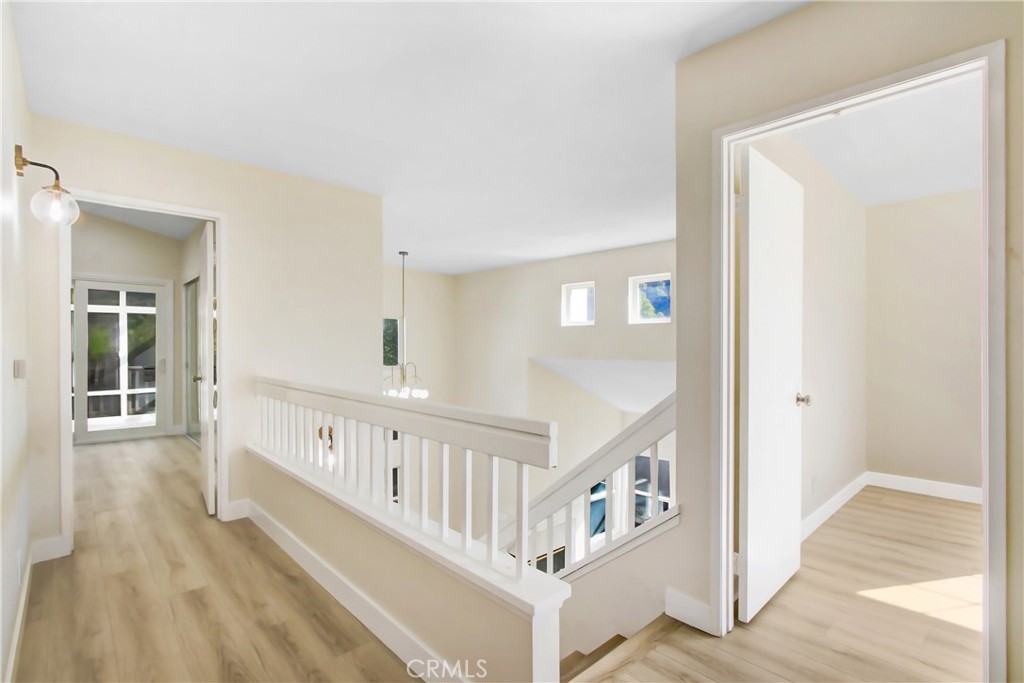 44738 Corte Gutierrez Temecula, CA 92592 - Photo 22 of 24 a view of a hallway with wooden floor and entryway