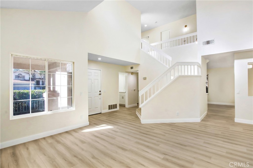 44738 Corte Gutierrez Temecula, CA 92592 - Photo 4 of 24 a view of empty room with wooden floor and fan