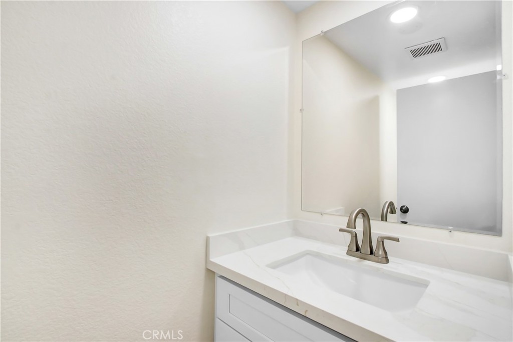 44738 Corte Gutierrez Temecula, CA 92592 - Photo 7 of 24 a bathroom with a sink and a mirror