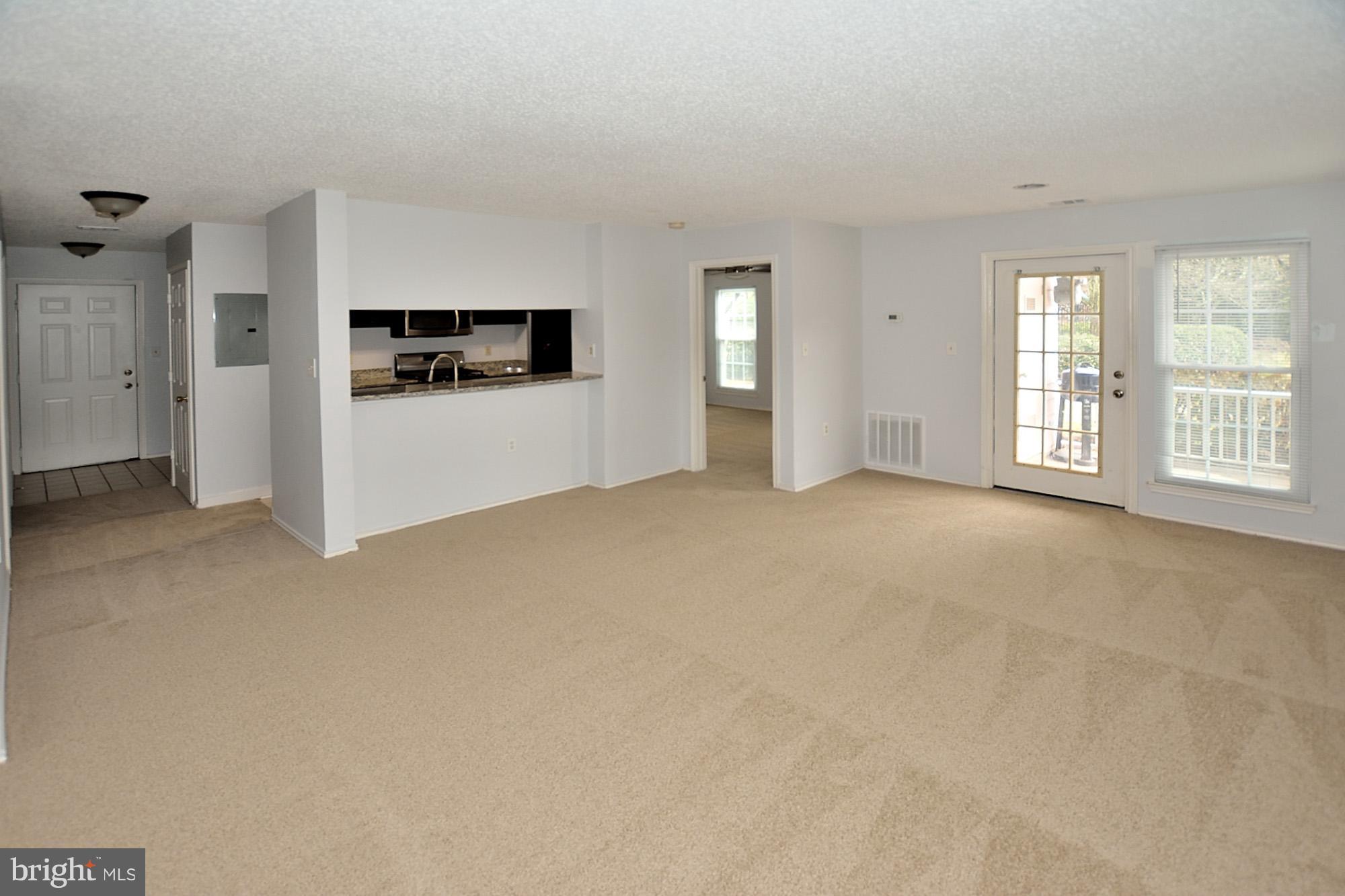 21029 Timber Ridge Terrace, Unit 101 Ashburn, VA 20147 - Photo 6 of 17 Living Room