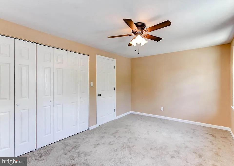1309 East Madison Street Baltimore, MD 21205 - Photo 13 of 20 a view of room with window and ceiling fan