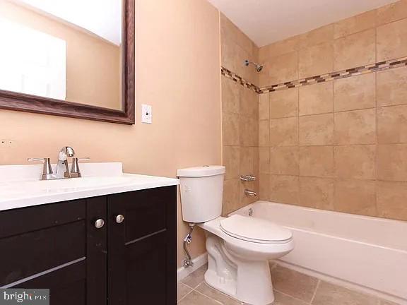 1309 East Madison Street Baltimore, MD 21205 - Photo 14 of 20 a bathroom with a sink a toilet and shower