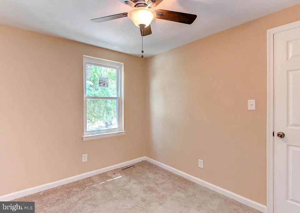 1309 East Madison Street Baltimore, MD 21205 - Photo 17 of 20 a view of an empty room with a window