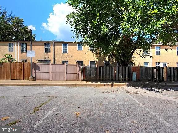 1309 East Madison Street Baltimore, MD 21205 - Photo 19 of 20 a row of trees with a yard