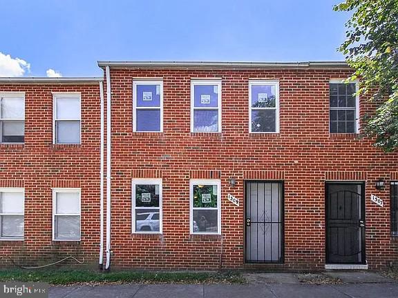 1309 East Madison Street Baltimore, MD 21205 - Photo 2 of 20 a front view of a house