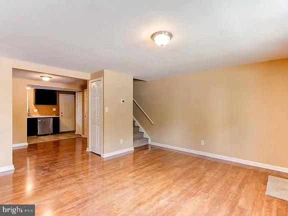 1309 East Madison Street Baltimore, MD 21205 - Photo 5 of 20 a view of empty room with wooden floor and cabinet