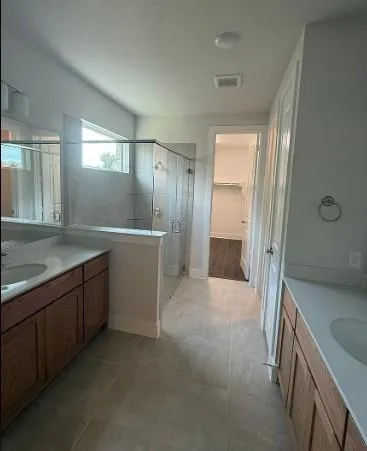 a view of a room with large windows and a big yard