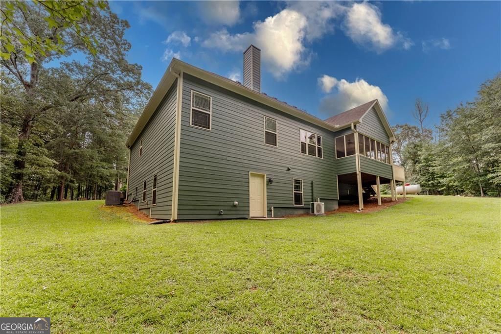 1158 Bailey Road Aragon, GA 30104 - Photo 64 of 73 a view of a house with patio and a yard