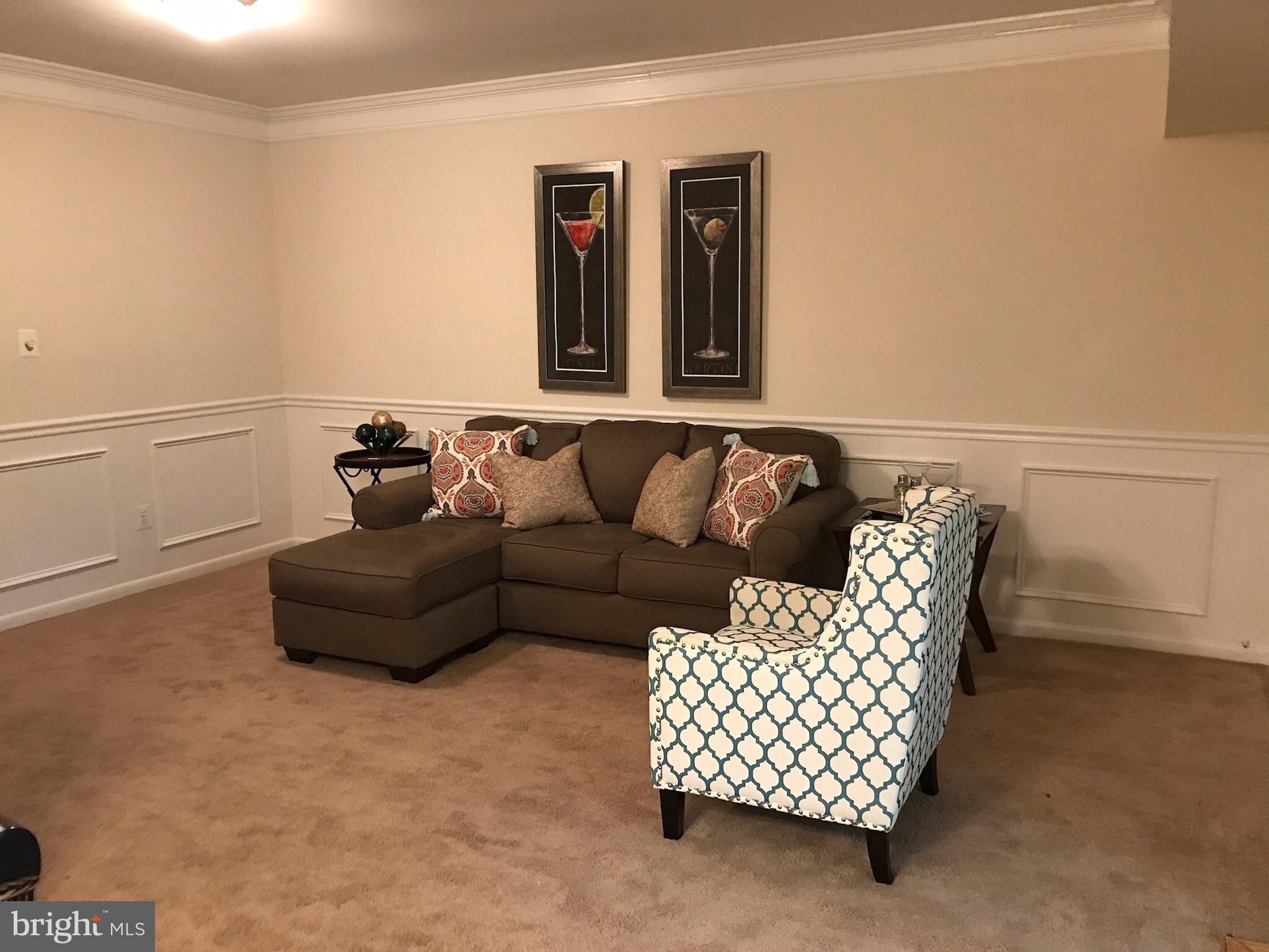 11629 Stoneview Square, Unit 21C Reston, VA 20191 - Photo 11 of 30 a living room with furniture
