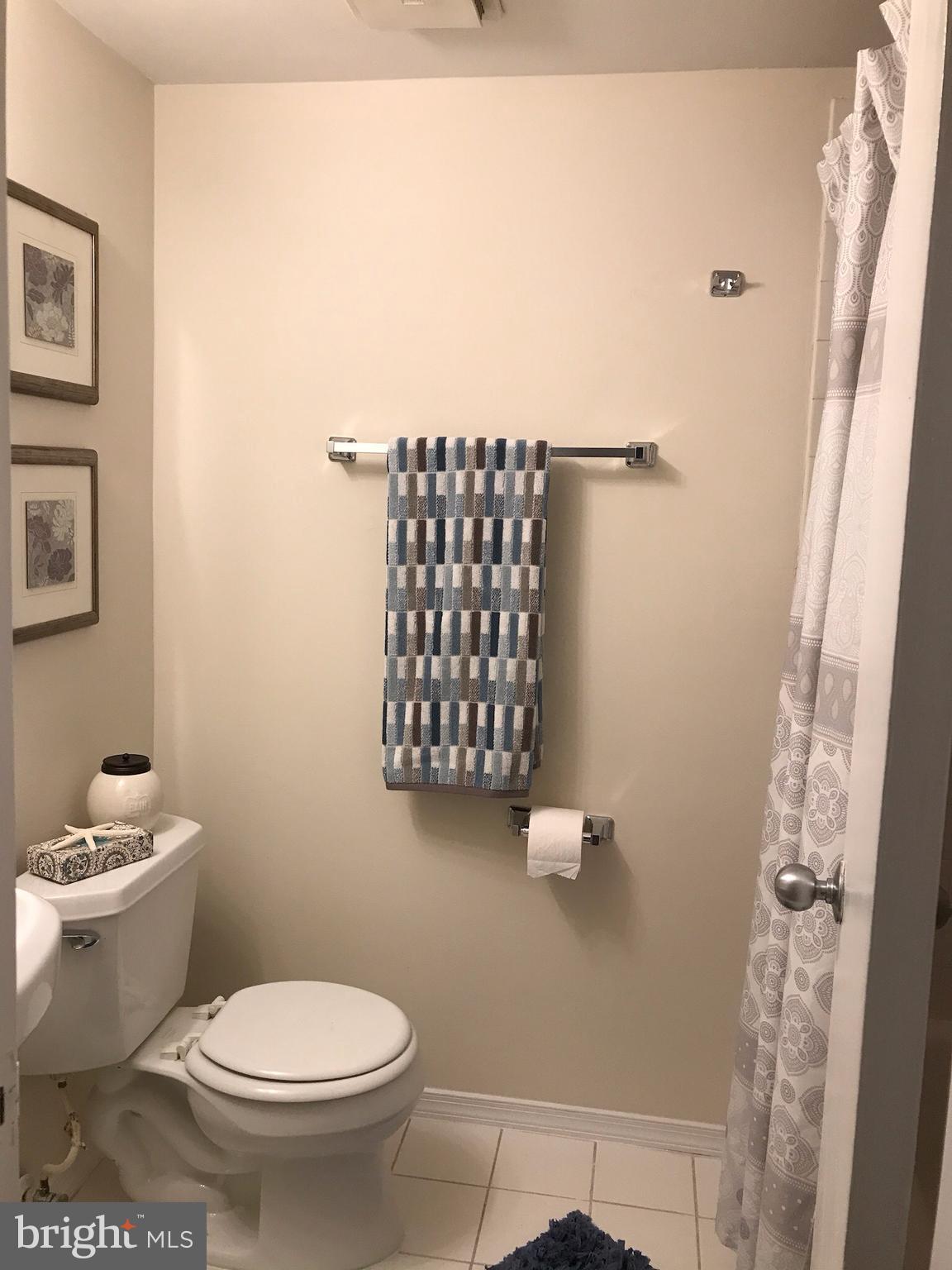 11629 Stoneview Square, Unit 21C Reston, VA 20191 - Photo 23 of 30 a bathroom with a toilet and a shower