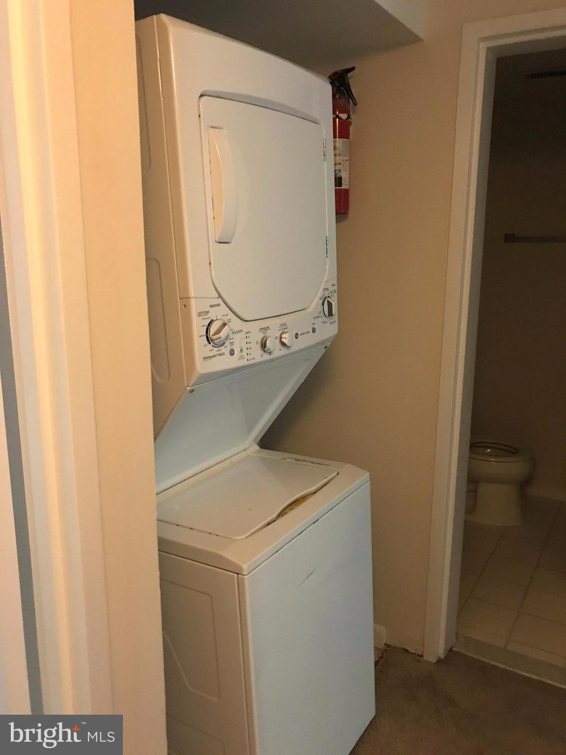 11629 Stoneview Square, Unit 21C Reston, VA 20191 - Photo 27 of 30 a utility room with dryer and washer