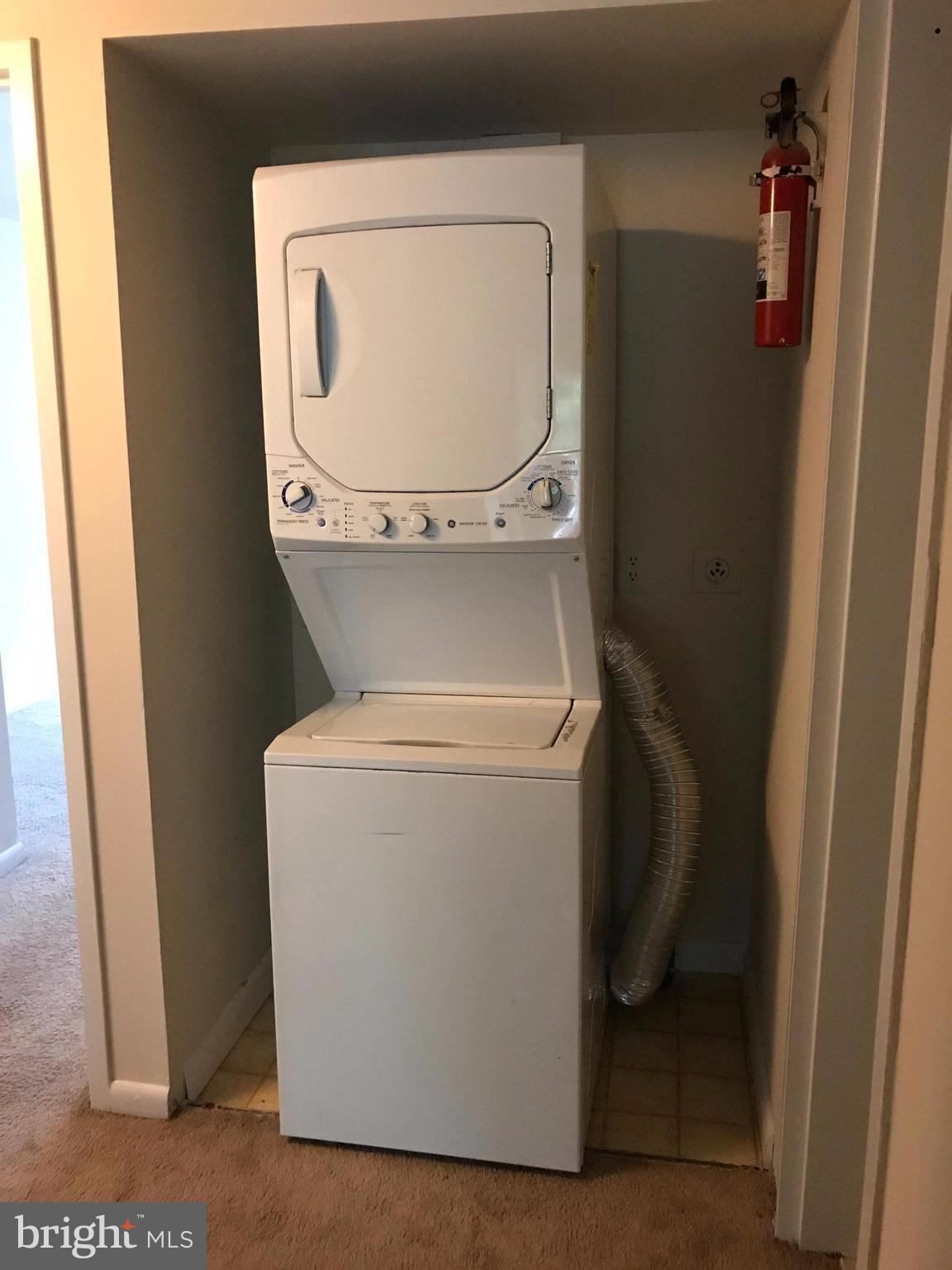 11629 Stoneview Square, Unit 21C Reston, VA 20191 - Photo 28 of 30 a utility room with dryer and washer