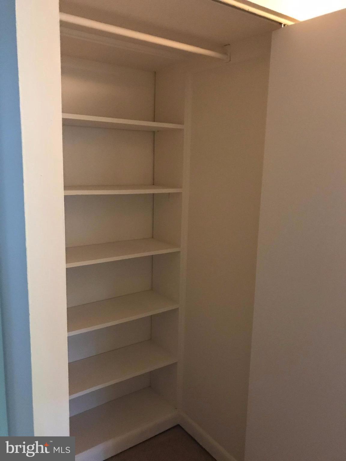 11629 Stoneview Square, Unit 21C Reston, VA 20191 - Photo 29 of 30 a view of walk in closet with empty racks