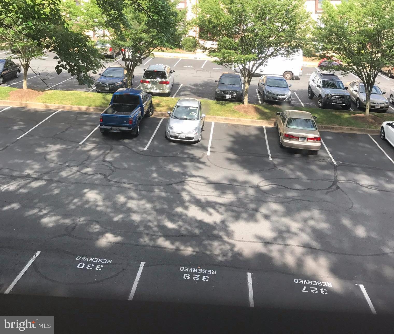 11629 Stoneview Square, Unit 21C Reston, VA 20191 - Photo 30 of 30 a swimming pool with some trees in front of it