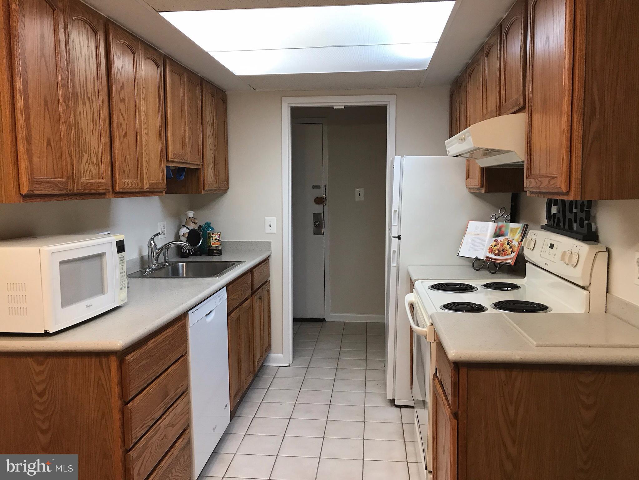 11629 Stoneview Square, Unit 21C Reston, VA 20191 - Photo 4 of 30 a kitchen with a sink cabinets and appliances