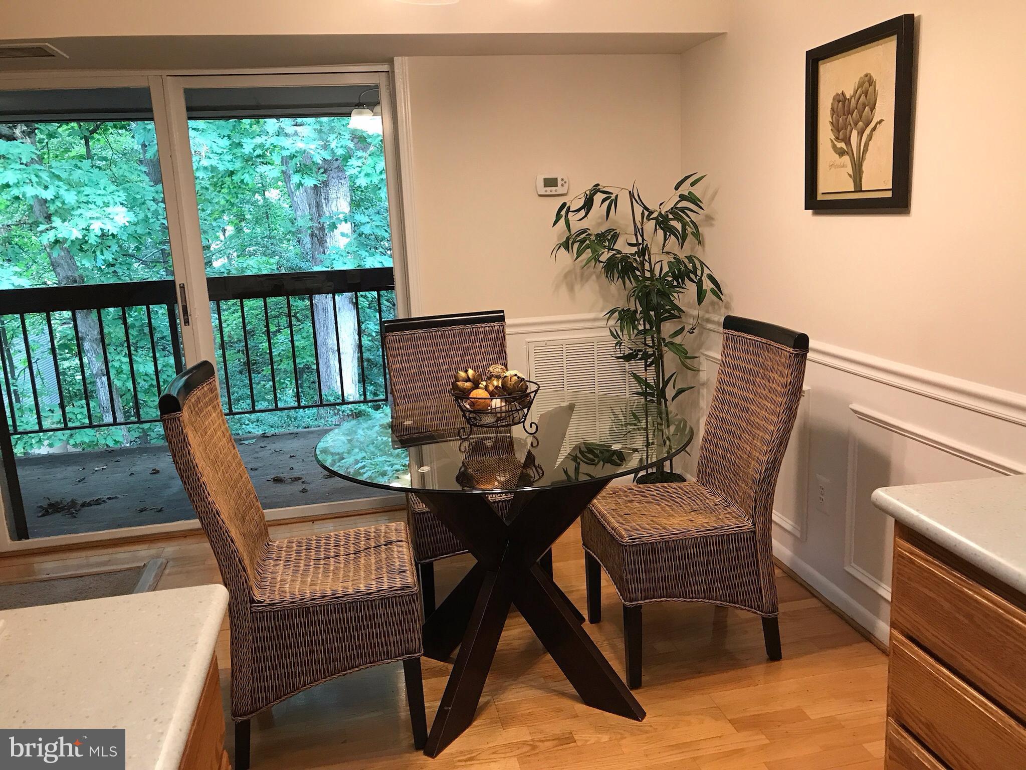 11629 Stoneview Square, Unit 21C Reston, VA 20191 - Photo 7 of 30 a view of a dining room with furniture window and outside view