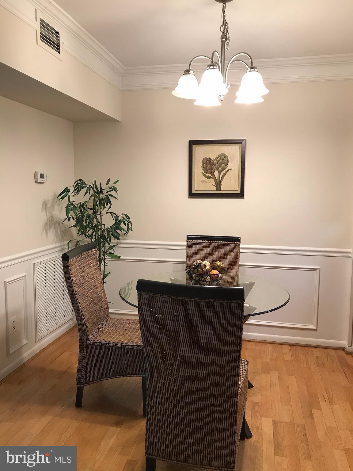 11629 Stoneview Square, Unit 21C Reston, VA 20191 - Photo 8 of 30 a dining room with furniture and window
