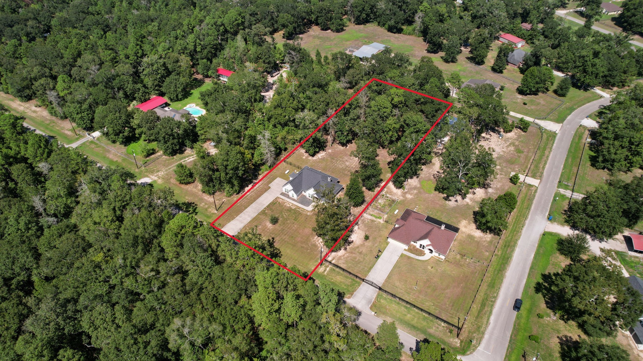 7815 Timber Switch Road Cleveland, TX 77328 - Photo 1 of 39 Spacious property with lush greenery, offering privacy and tranquility in a serene neighborhood setting.