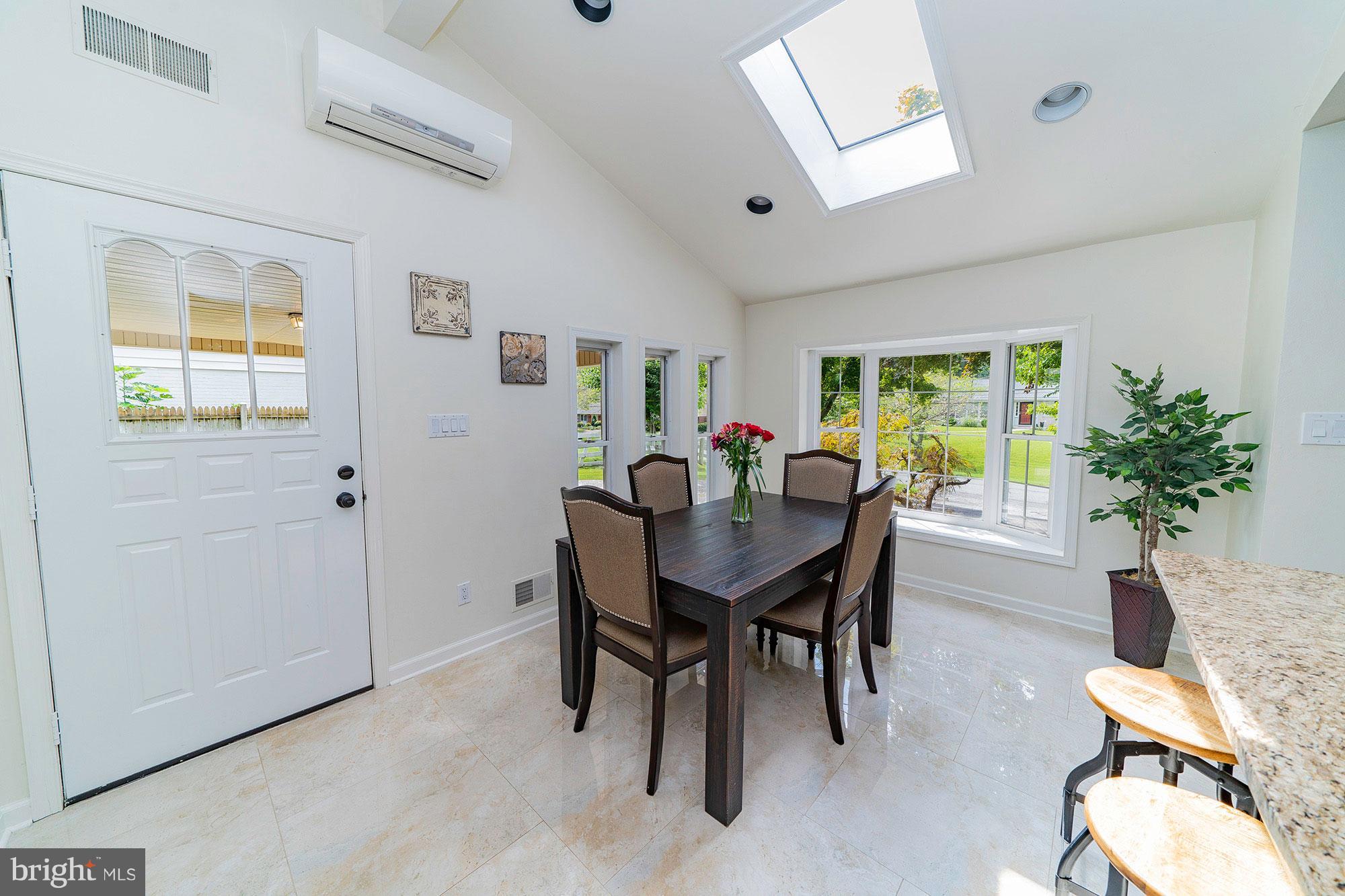 521 Beaumont Road Silver Spring, MD 20904 - Photo 12 of 30 a view of a dining room with furniture and a potted plant