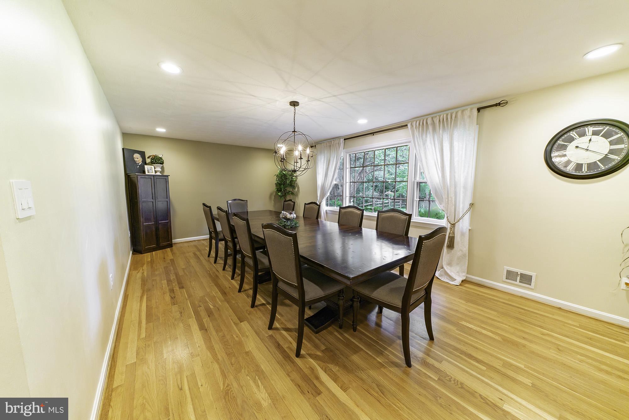 521 Beaumont Road Silver Spring, MD 20904 - Photo 17 of 30 a view of a dining room with furniture and wooden floor