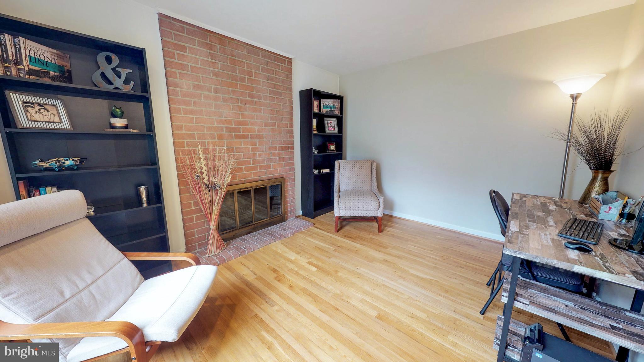 521 Beaumont Road Silver Spring, MD 20904 - Photo 19 of 30 a living room with furniture and a fireplace