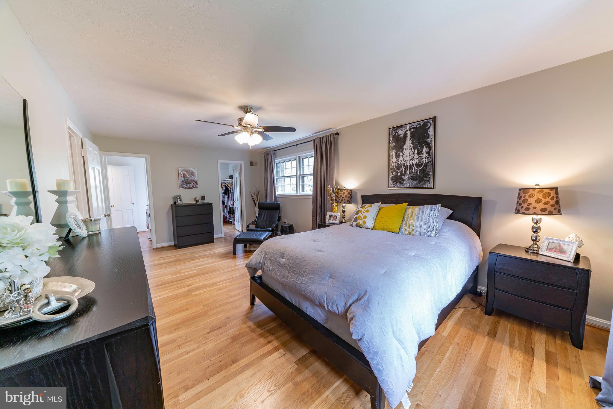 521 Beaumont Road Silver Spring, MD 20904 - Photo 20 of 30 a bedroom with a bed and wooden floor