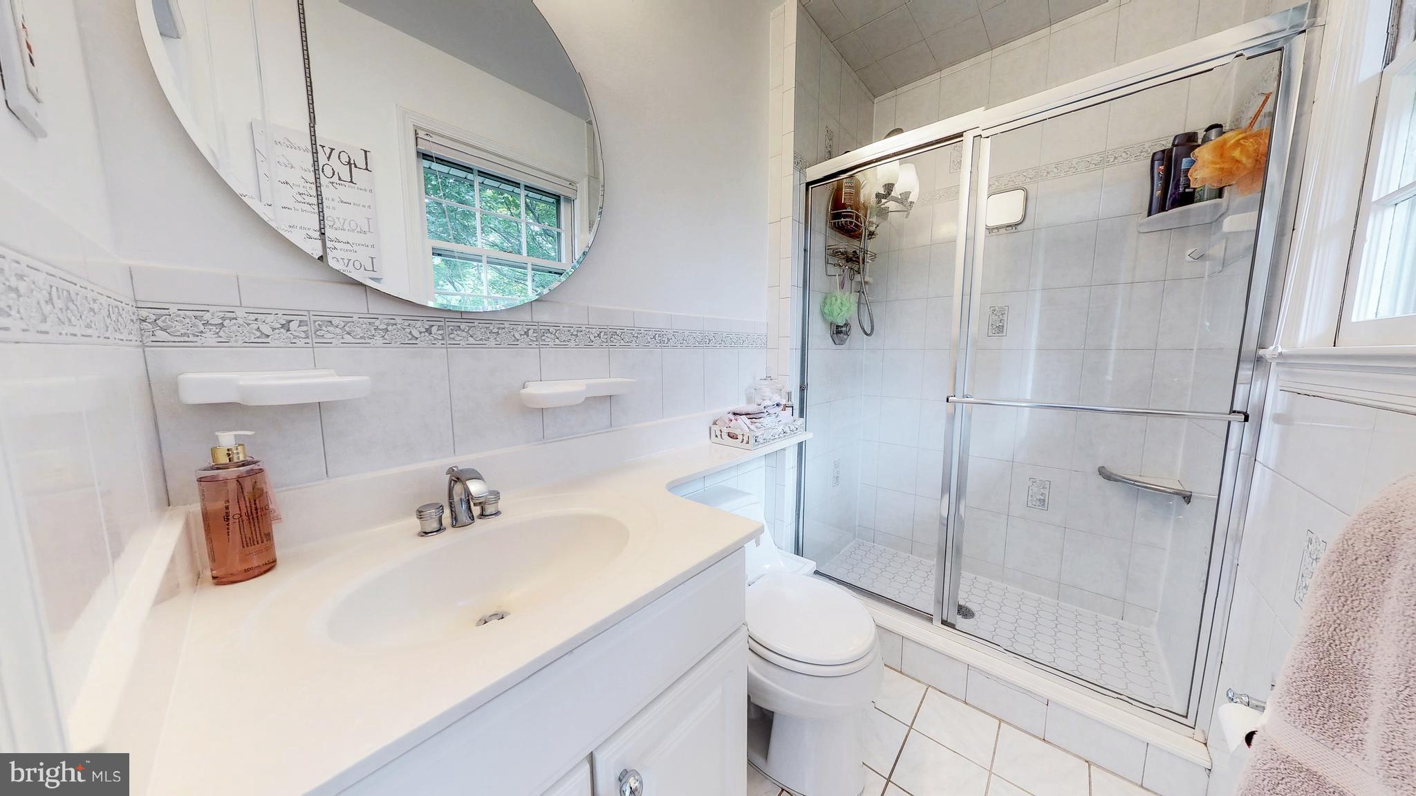 521 Beaumont Road Silver Spring, MD 20904 - Photo 21 of 30 a bathroom with a toilet sink and shower