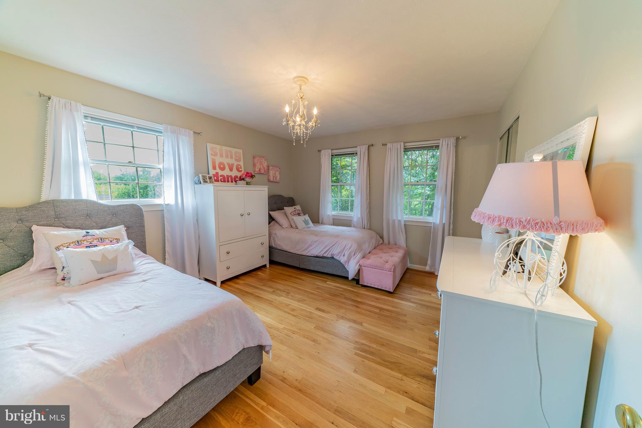 521 Beaumont Road Silver Spring, MD 20904 - Photo 22 of 30 a bedroom with a bed and a couch