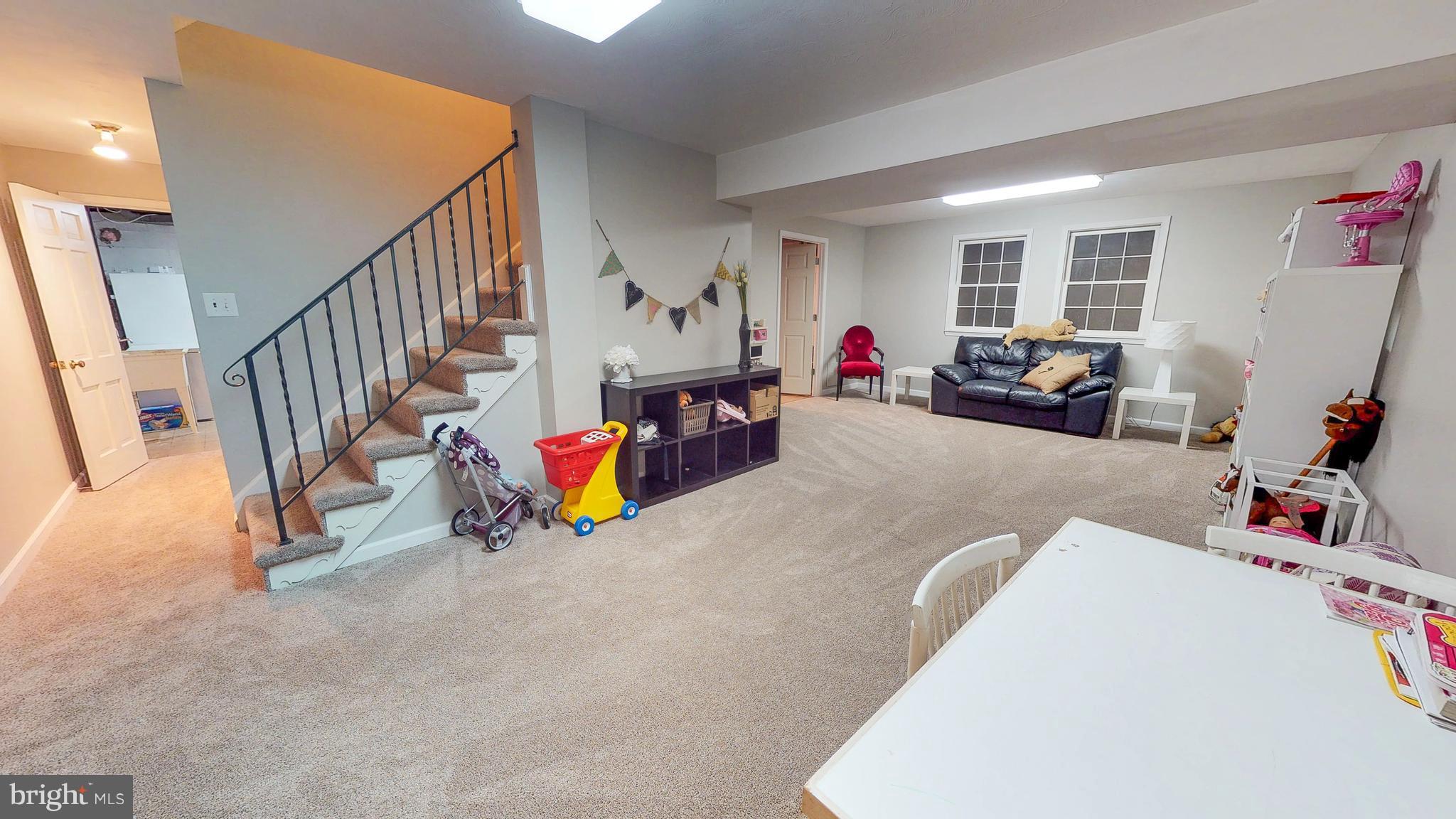 521 Beaumont Road Silver Spring, MD 20904 - Photo 26 of 30 a view of a livingroom with furniture and stairs
