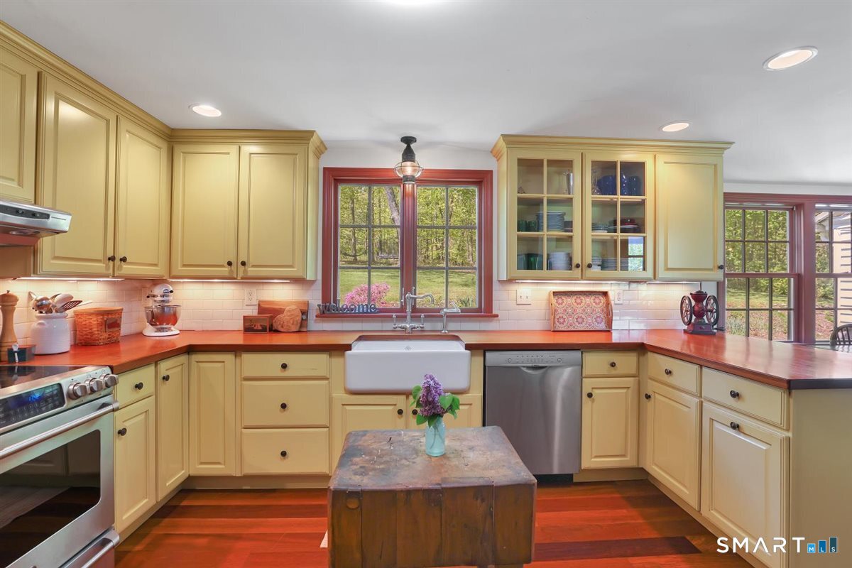 292 Parmelee Hill Road Durham, CT 06422 - Photo 8 of 39 Timeless remodeled kitchen with Brazilian cherry floors, stainless appliances, and Shaws fireclay farmhouse sink