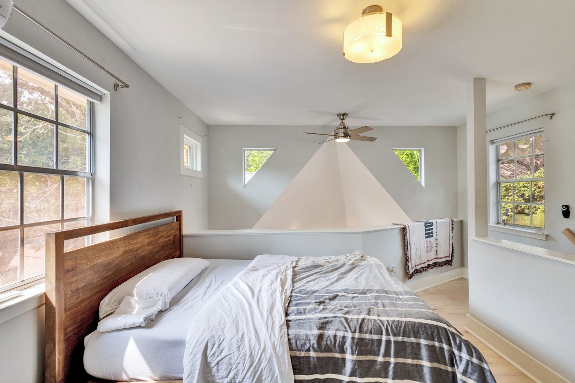 1702 Drake Avenue Austin, TX 78704 - Photo 1 of 1 a bedroom with a bed and a window