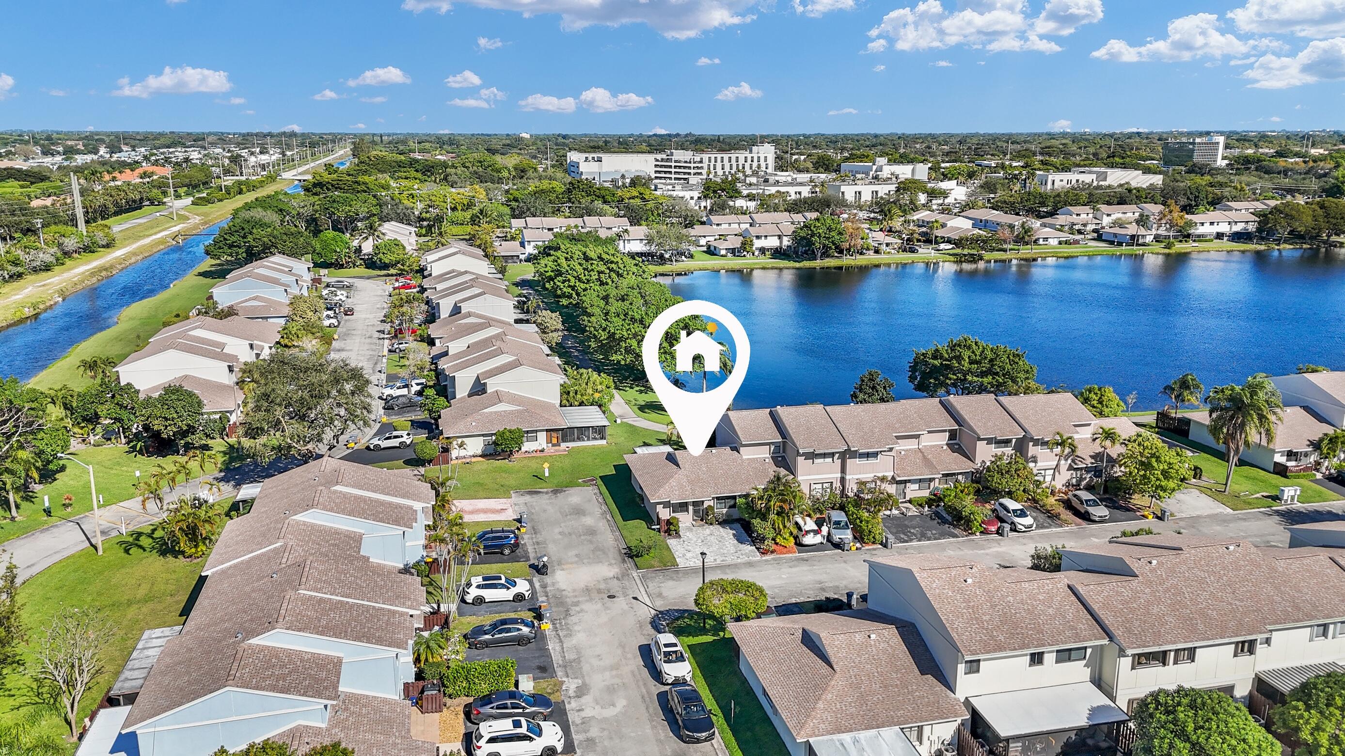 5347 Tennis Lane, Unit 5347 Delray Beach, FL 33484 - Photo 2 of 41 an aerial view of residential houses with outdoor space and lake view