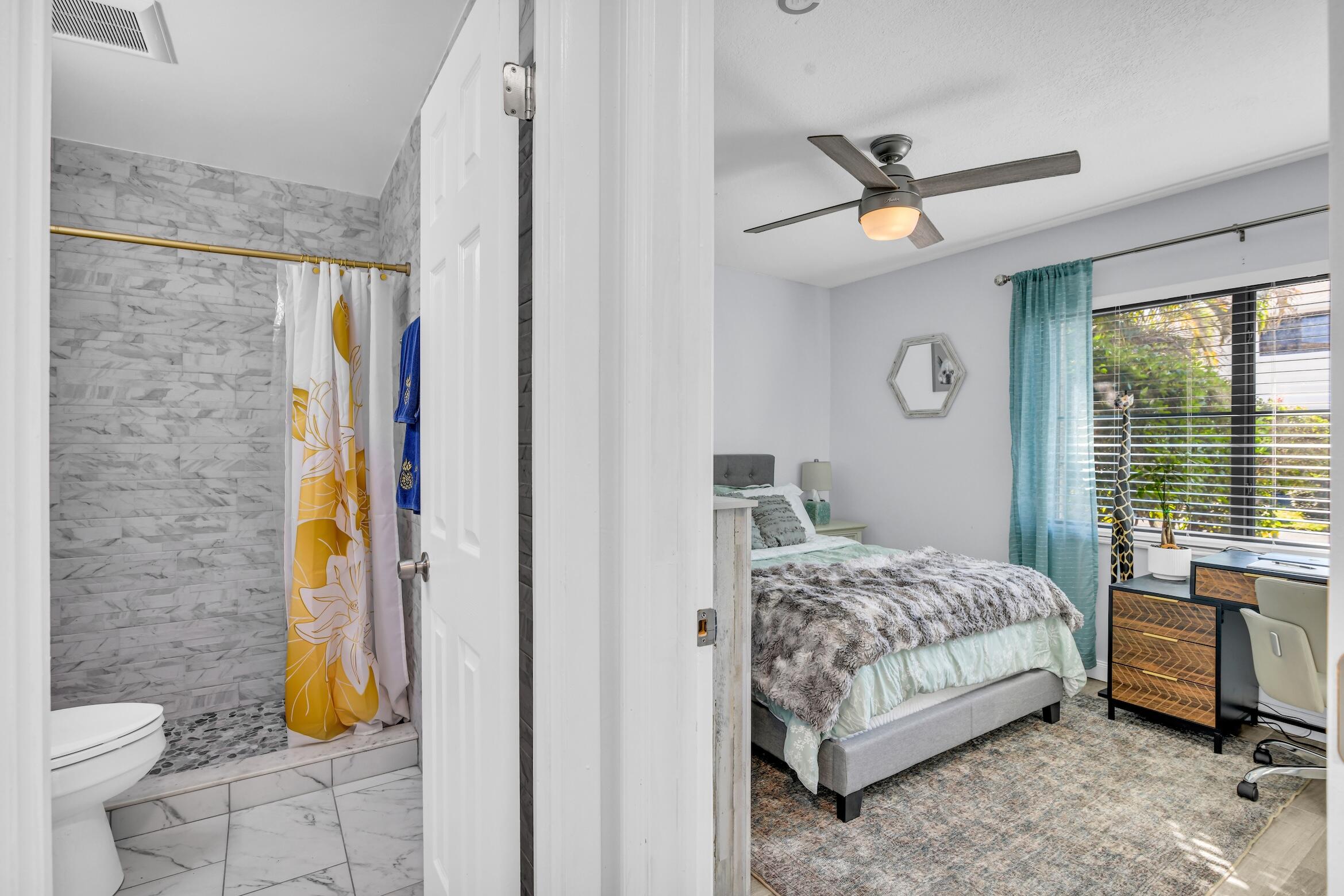 5347 Tennis Lane, Unit 5347 Delray Beach, FL 33484 - Photo 25 of 41 a bedroom with a bed and a window