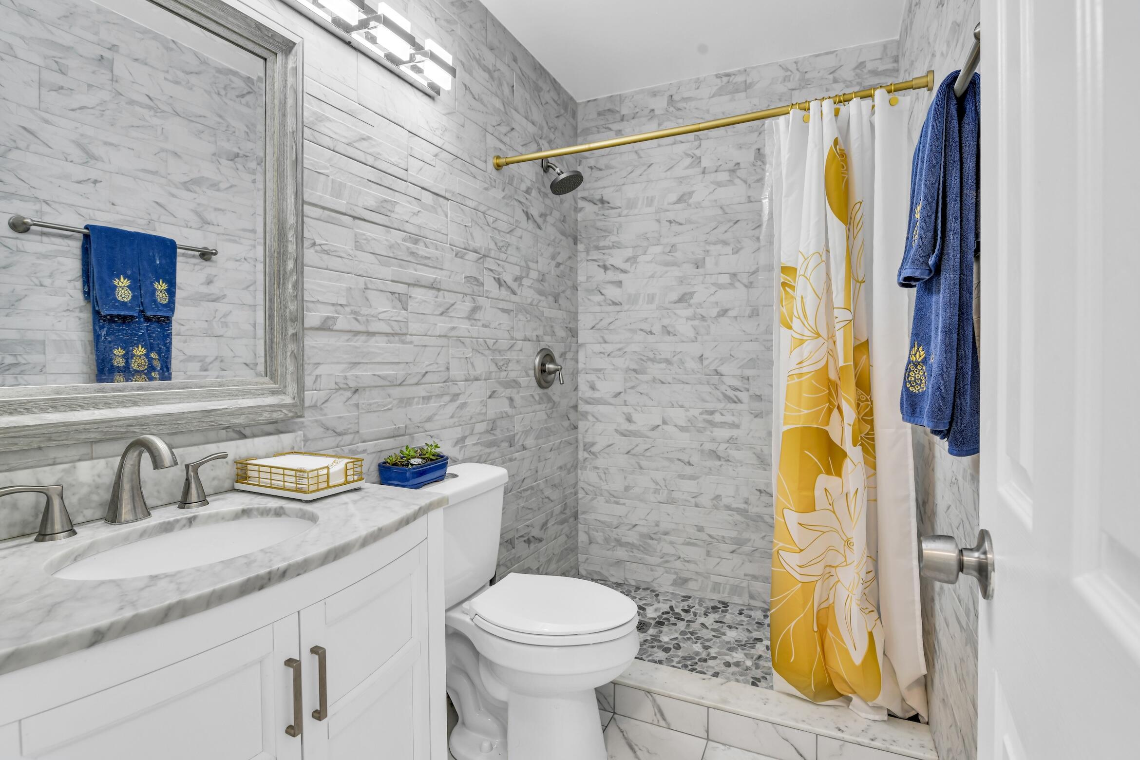 5347 Tennis Lane, Unit 5347 Delray Beach, FL 33484 - Photo 26 of 41 a bathroom with a sink toilet and shower