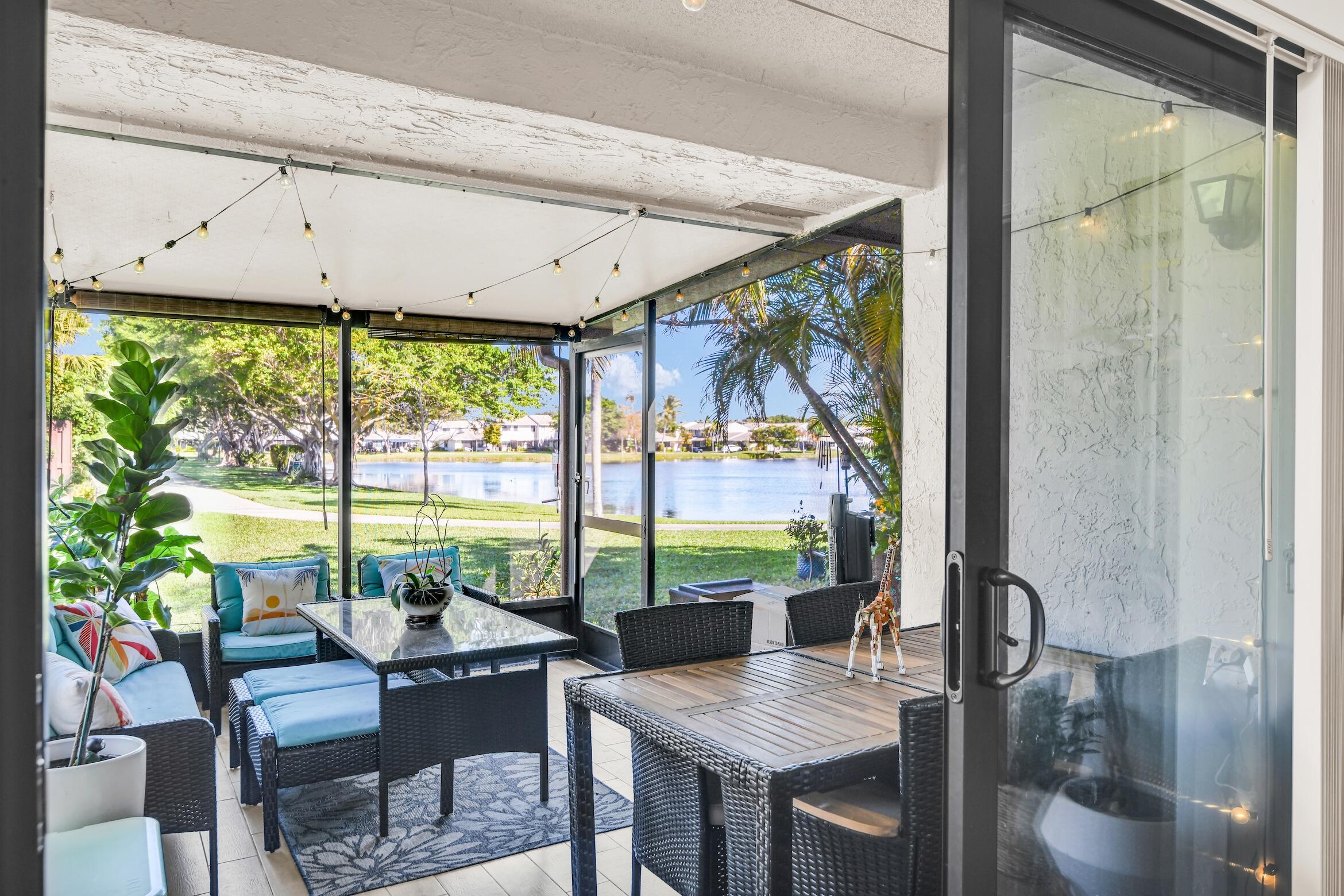 5347 Tennis Lane, Unit 5347 Delray Beach, FL 33484 - Photo 28 of 41 a view of a dining room with furniture window and outside view