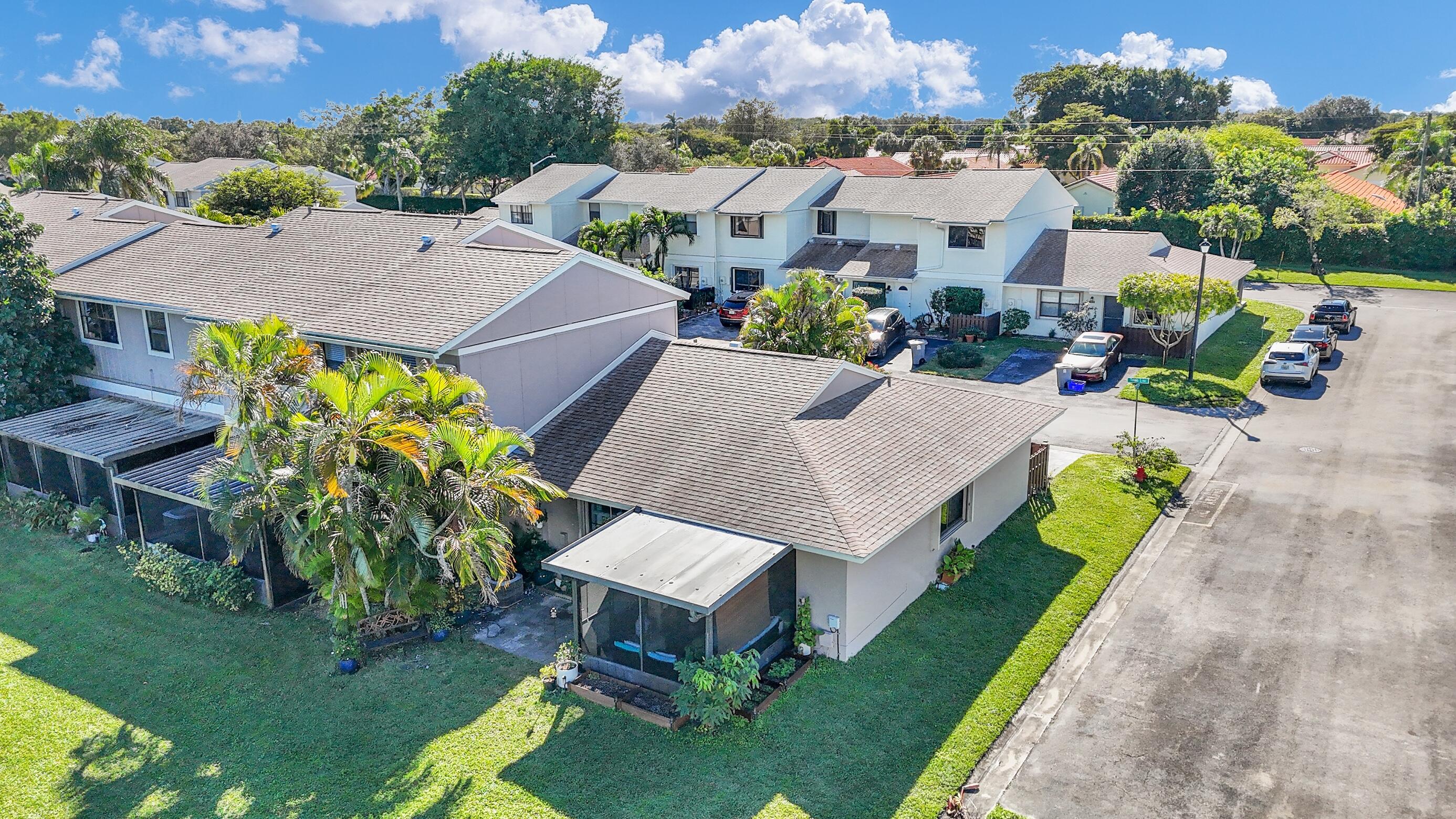 5347 Tennis Lane, Unit 5347 Delray Beach, FL 33484 - Photo 31 of 41 an aerial view of a house with a garden and plants