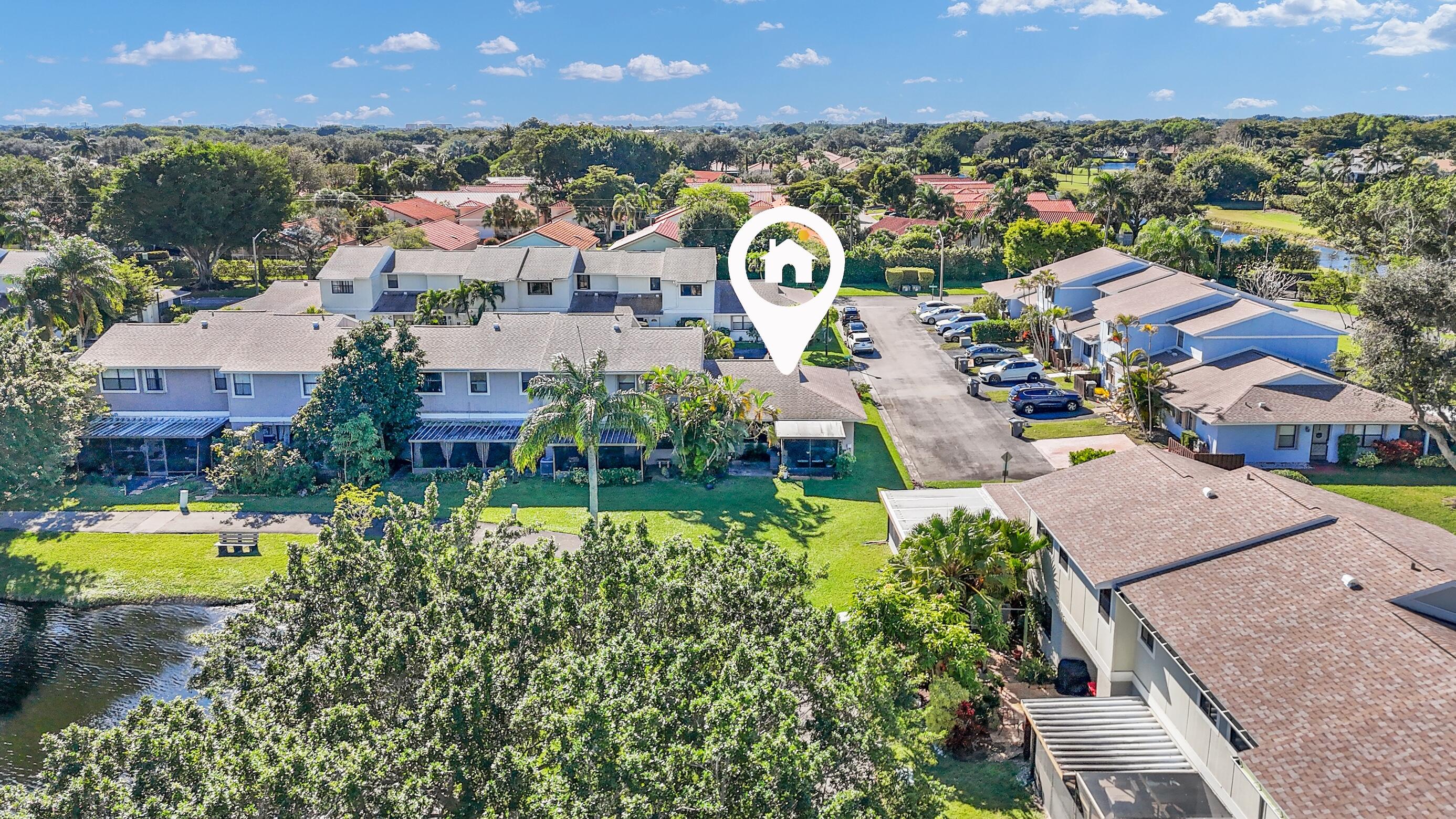 5347 Tennis Lane, Unit 5347 Delray Beach, FL 33484 - Photo 32 of 41 an aerial view of residential houses with outdoor space and swimming pool