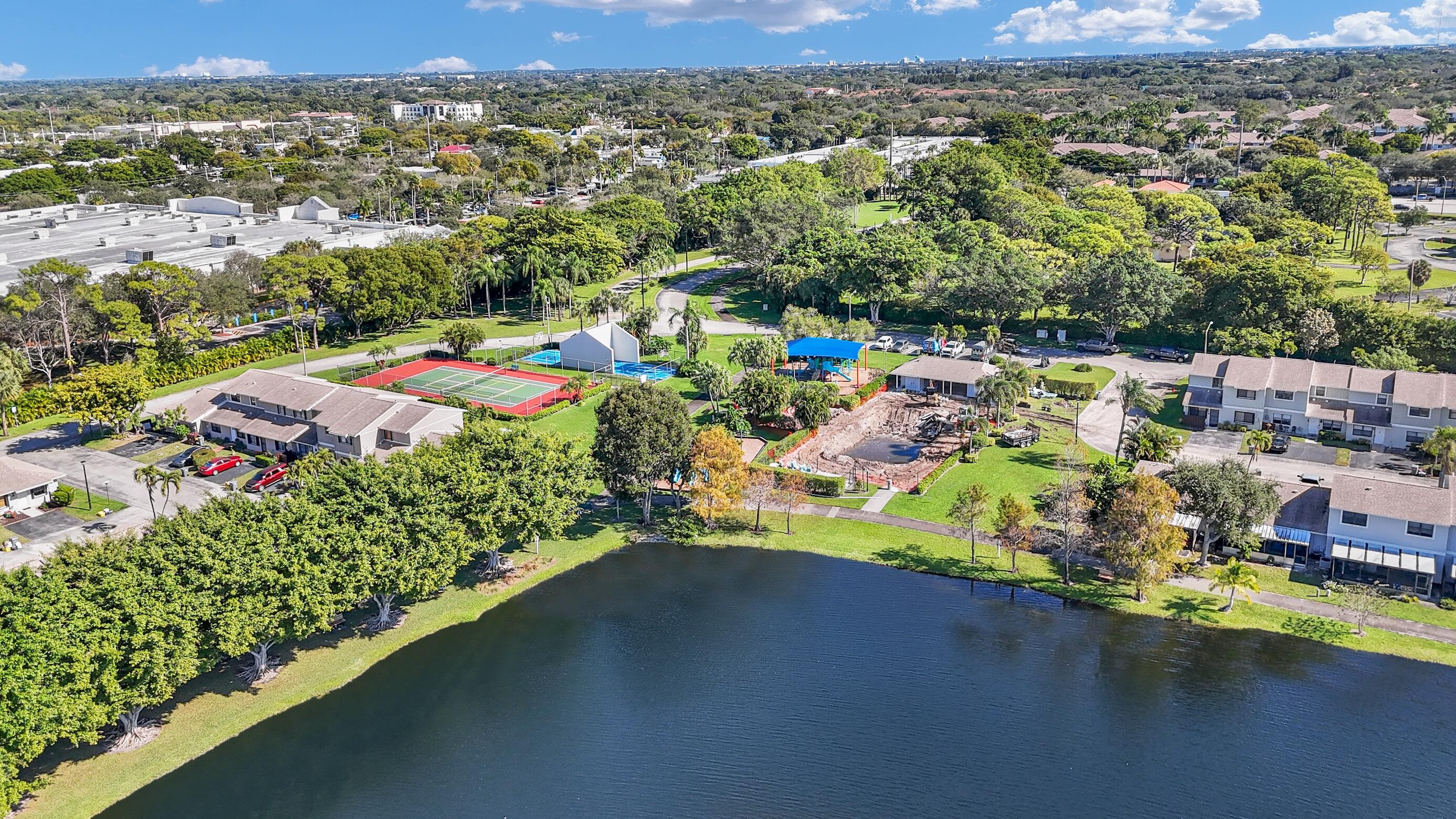 5347 Tennis Lane, Unit 5347 Delray Beach, FL 33484 - Photo 36 of 41 an aerial view of a houses with a lake view