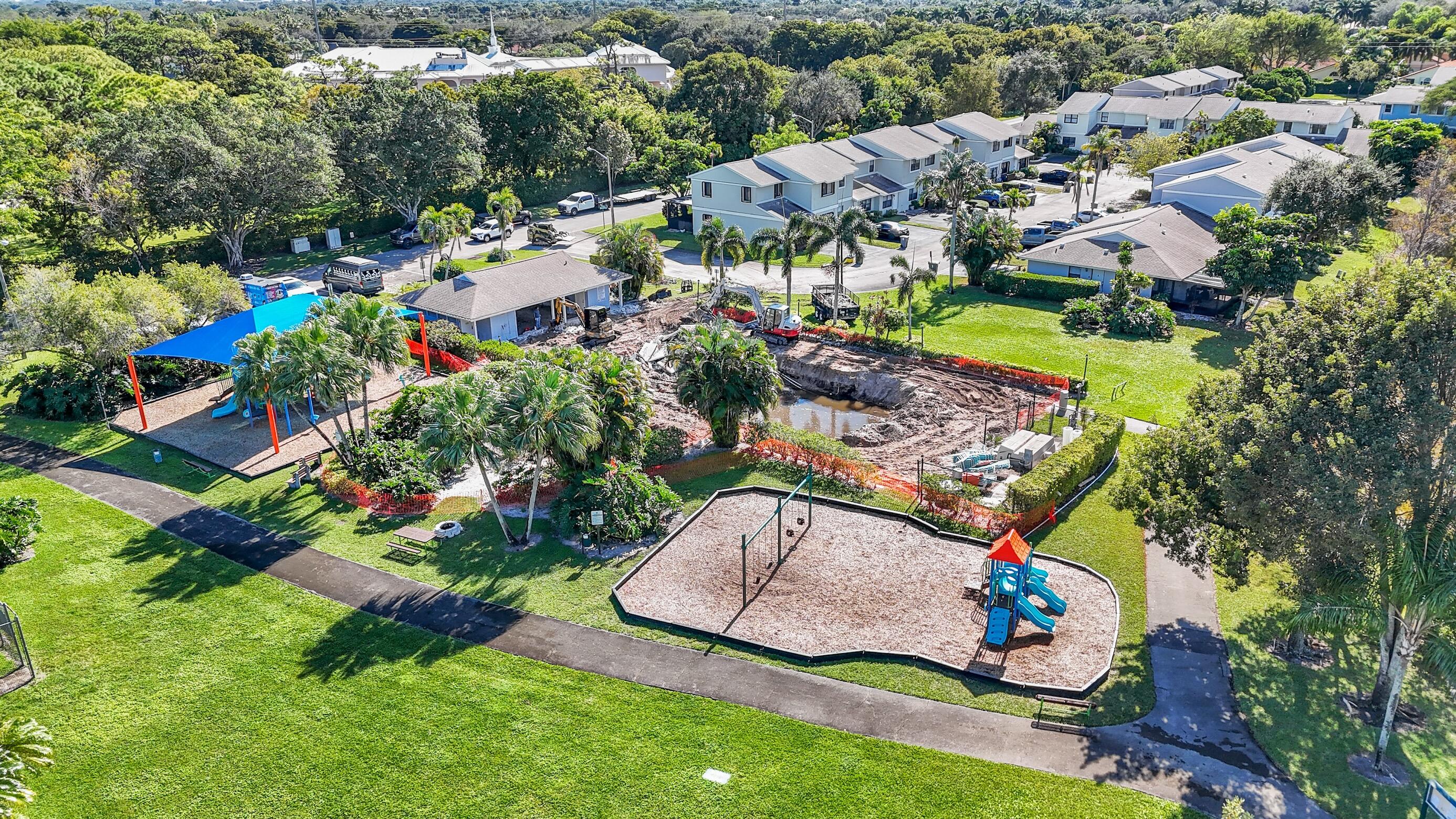 5347 Tennis Lane, Unit 5347 Delray Beach, FL 33484 - Photo 37 of 41 an aerial view of residential houses with outdoor space and swimming pool