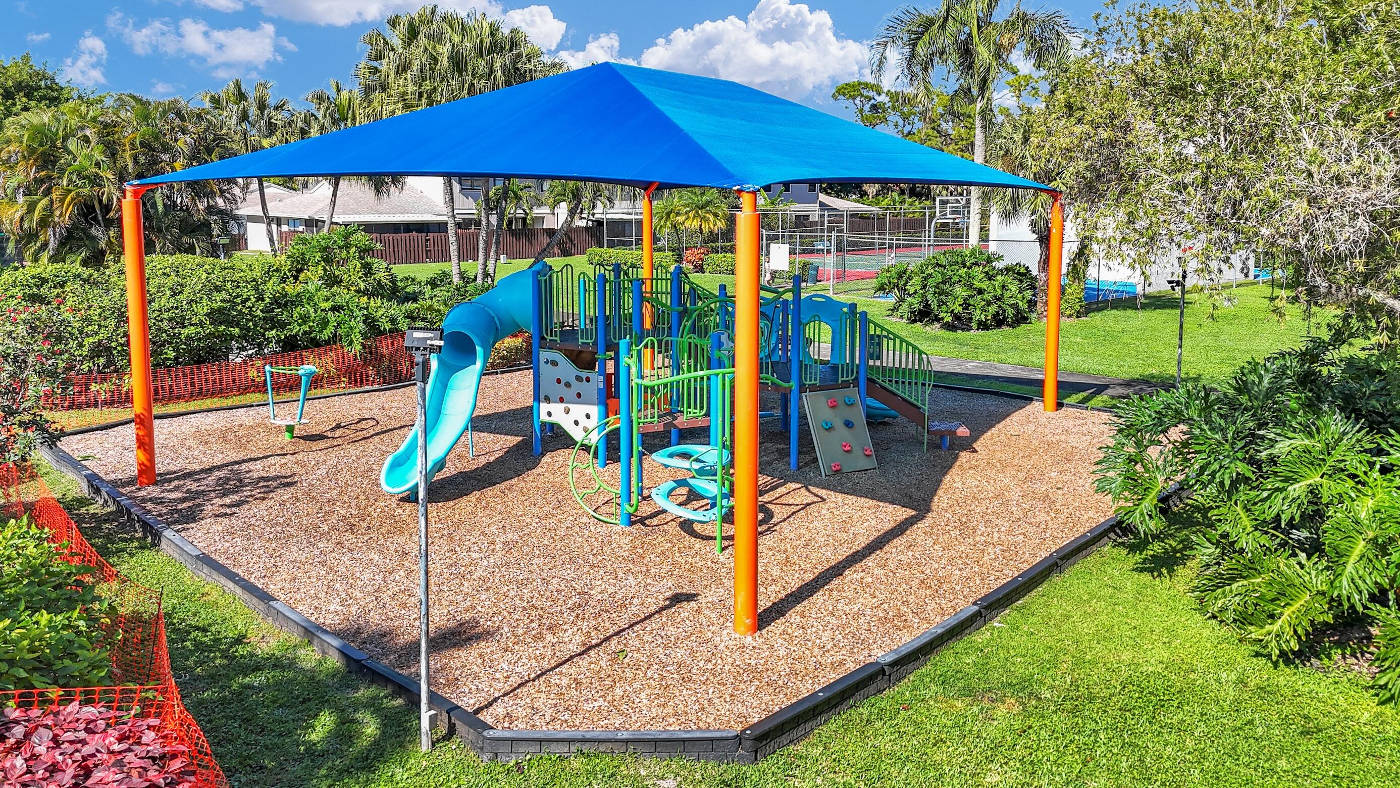 5347 Tennis Lane, Unit 5347 Delray Beach, FL 33484 - Photo 39 of 41 a view of a house with a yard